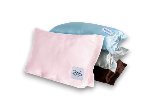 Pink satin travel pillow, smooth fabric detail and soft texture