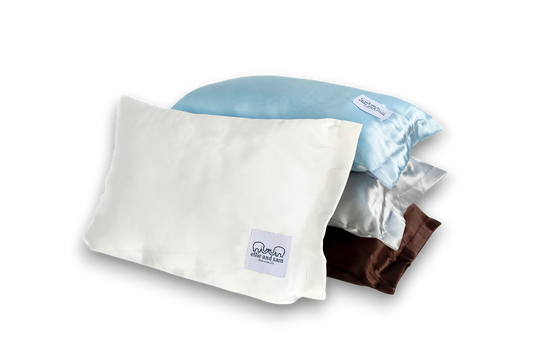 Ivory satin travel pillow, smooth fabric detail and soft texture