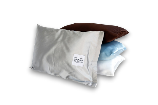 Silver satin travel pillow, smooth fabric detail and soft texture